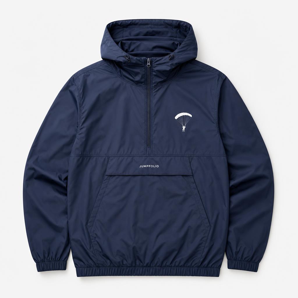 Navy technical nylon Jumpfolio pullover windbreaker with a half-zip collar, kangaroo pocket, and white skydiver emblem and JUMPFOLIO wordmark